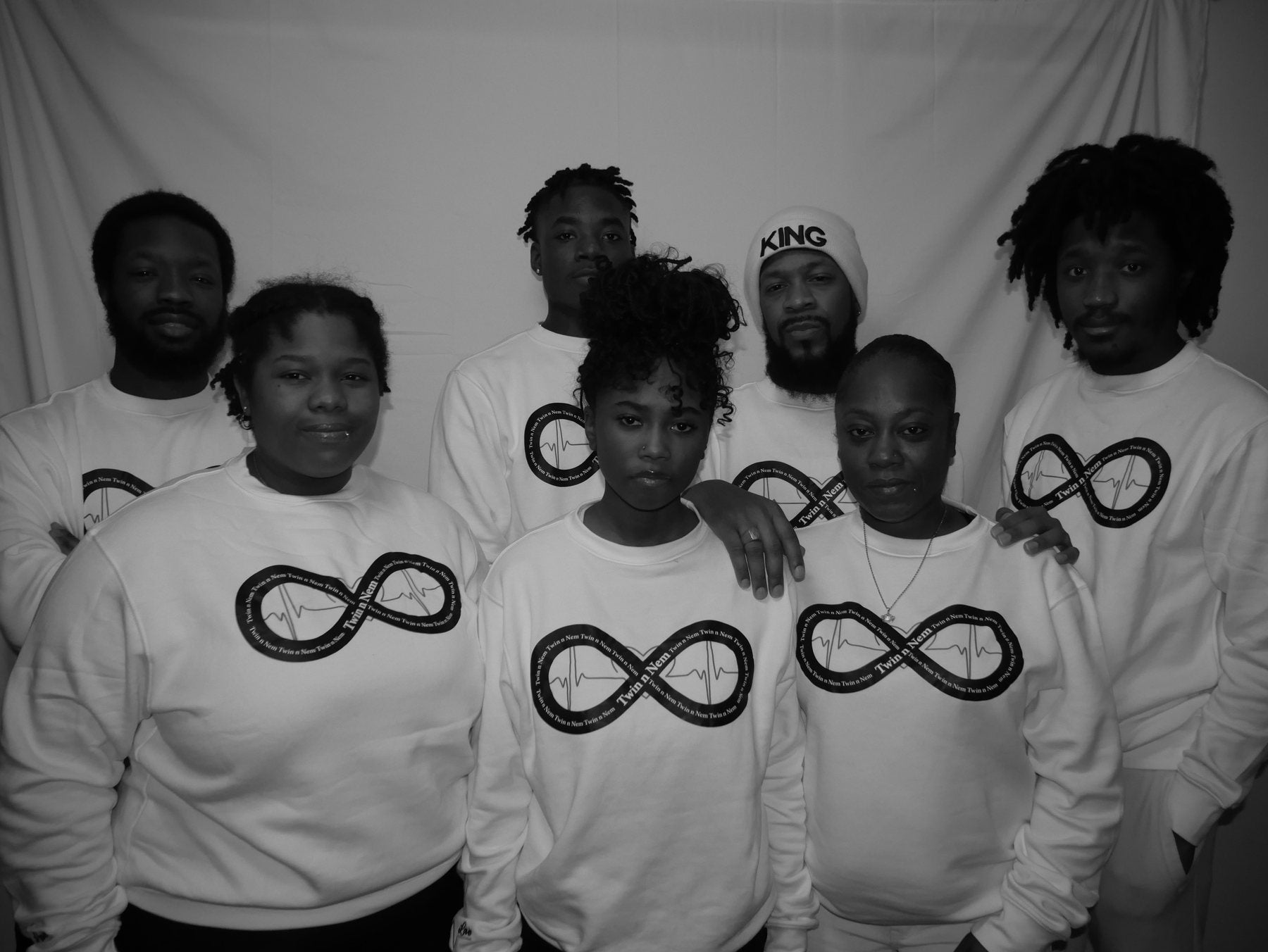 Twin n Nem family and community wearing the heartbeat collection