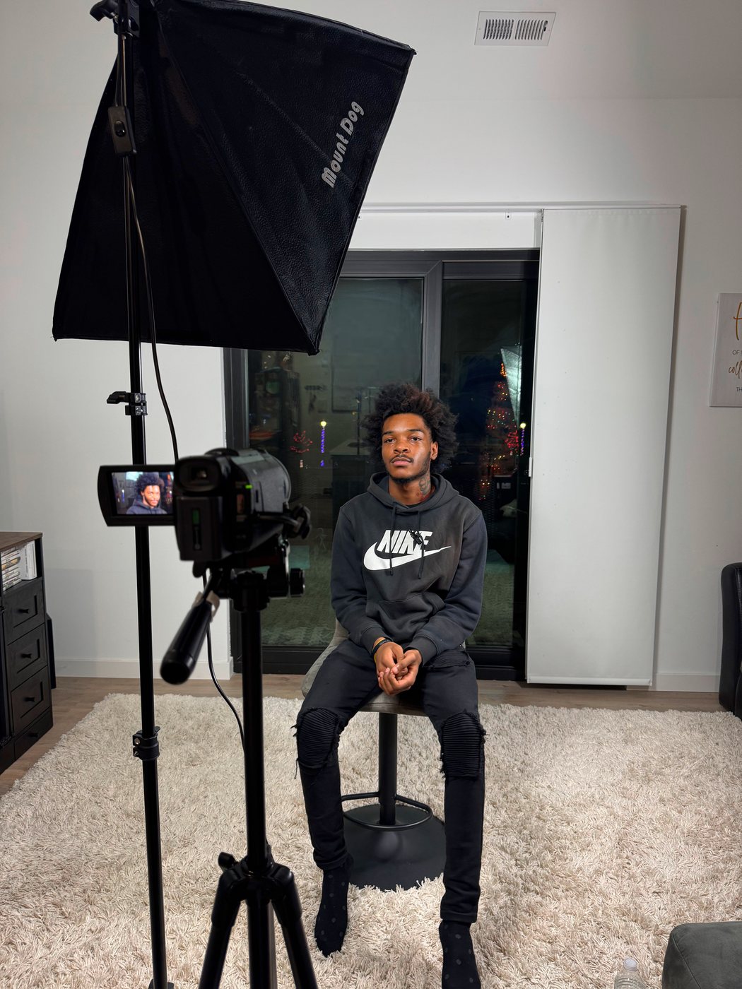 A Twin n Nem community member sharing his story on camera